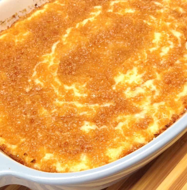 Cheesy Baked Cauliflower Mash in blue casserole dish