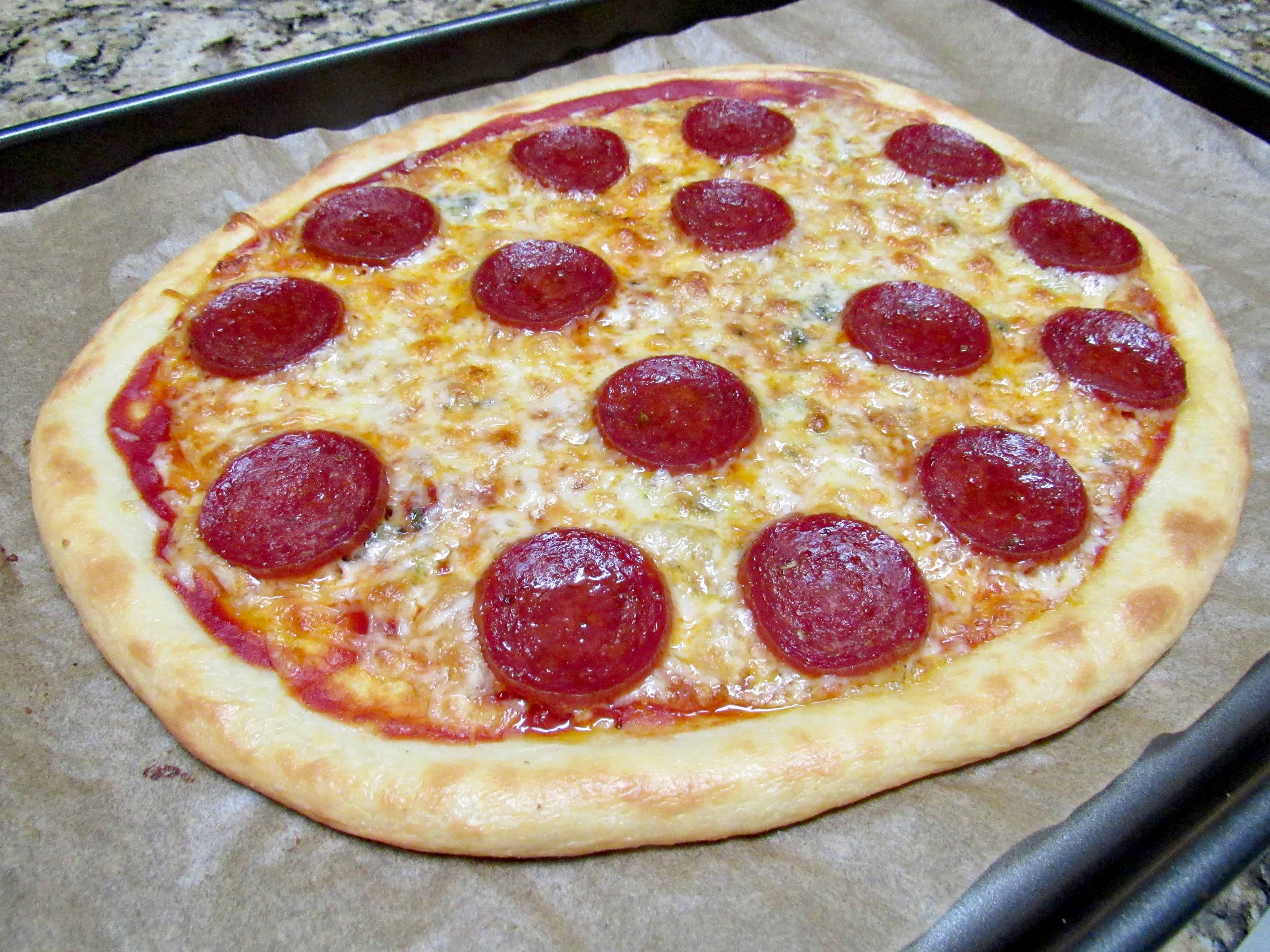 whole fathead pizza baked on sheet pan with pepperoni and cheese