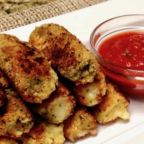 Keto/Low Carb/Gluten Free Mozarella Sticks on Serving Plate with Red Sauce
