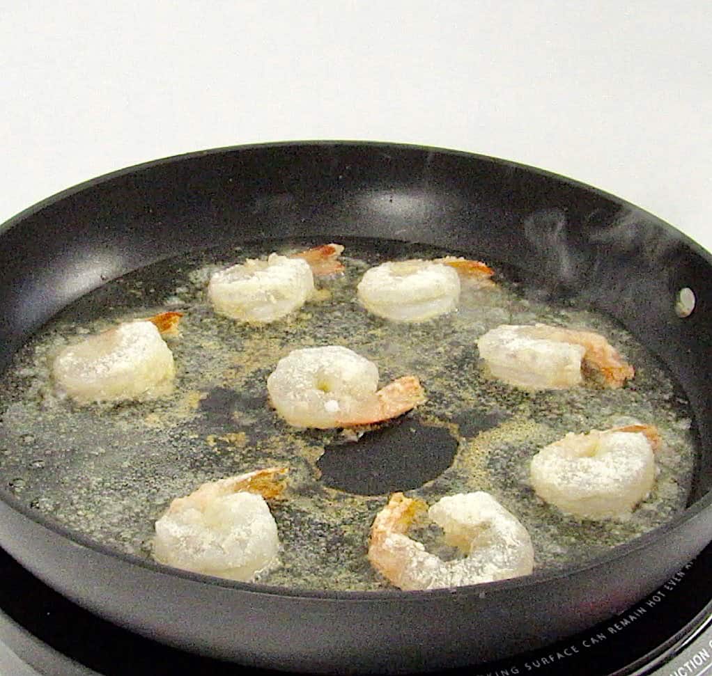 shrimp frying in skillet