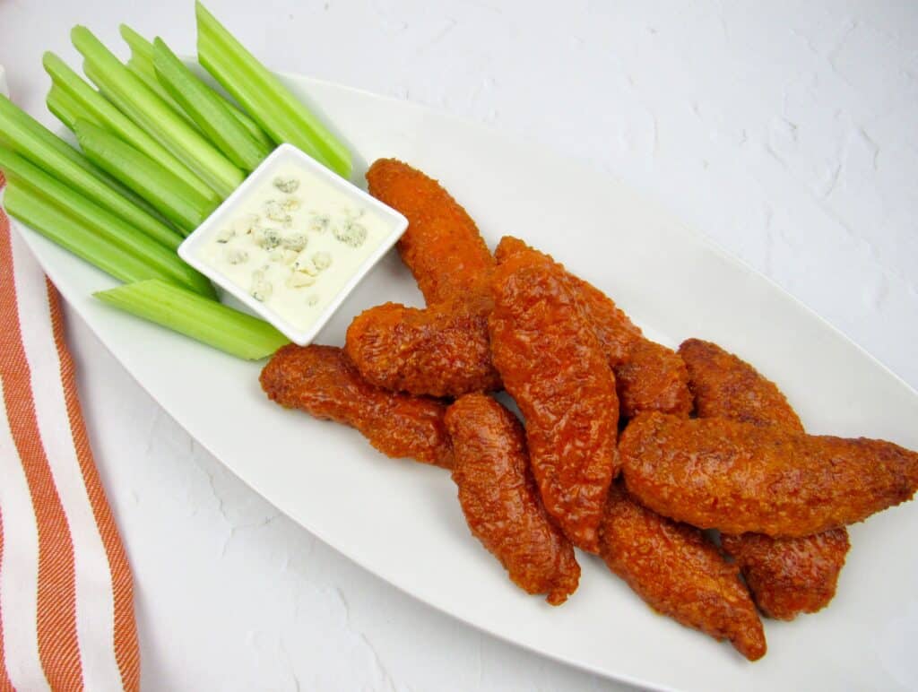 overhead view of buffalo tenders on white plate
