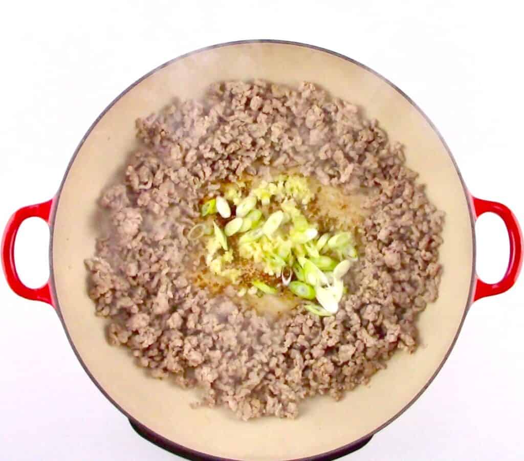 cooked ground pork with ginger, garlic and scallions in center
