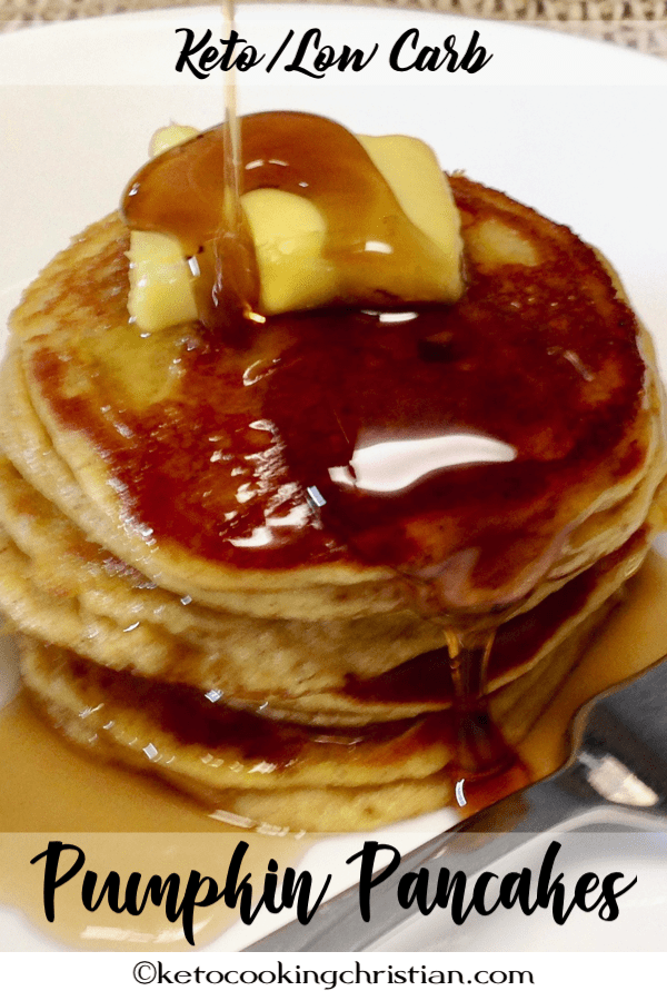 pumpkin pancakes on a plate with butter and syrup