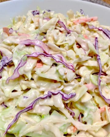 creamy coleslaw in white bowl