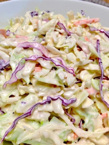 creamy coleslaw in white bowl
