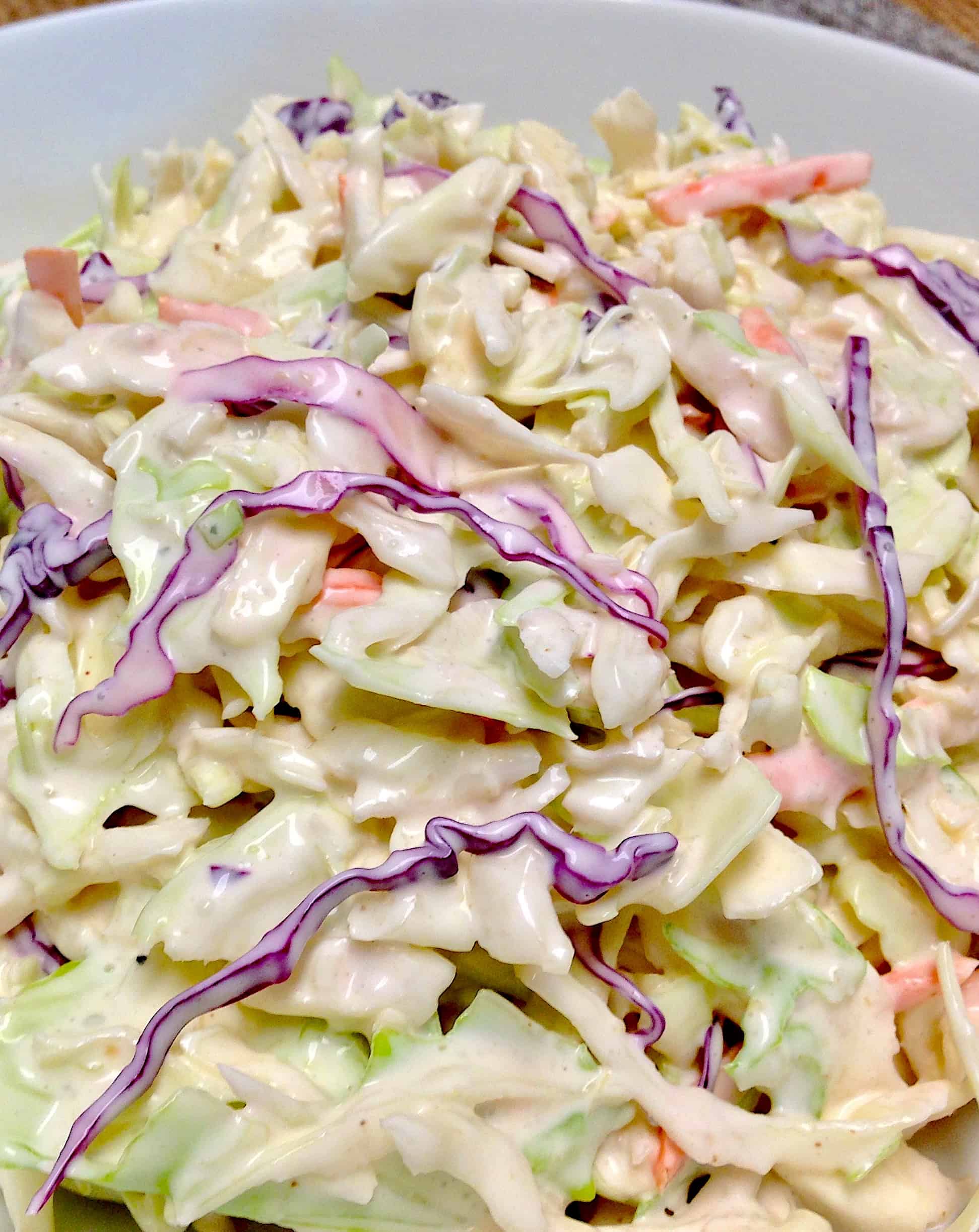 creamy coleslaw in white bowl