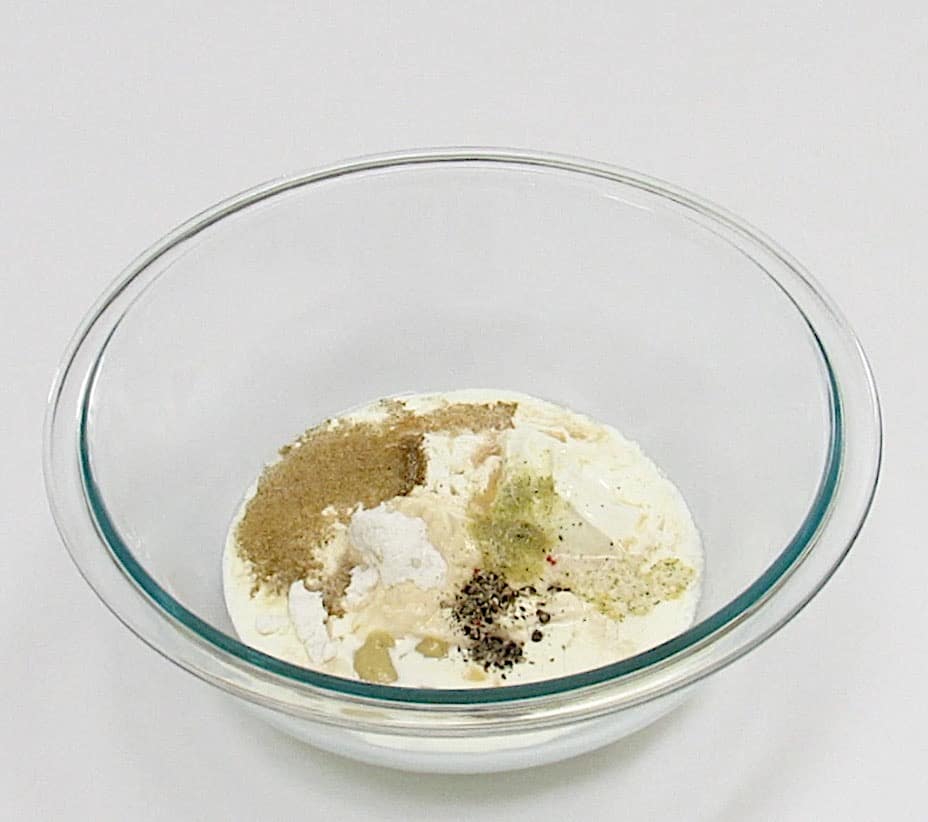 coleslaw dressing ingredients in glass bowl