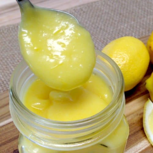 lemon curd spooned out of a jar