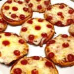 closeup of Pepperoni Pizza Bagels on white plate
