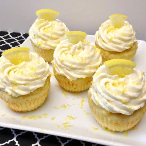 5 frosted lemon cupcakes on white plate