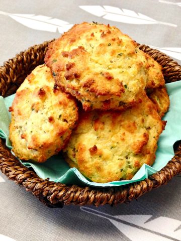basket with bacon cheddar drop biscuits stacked up