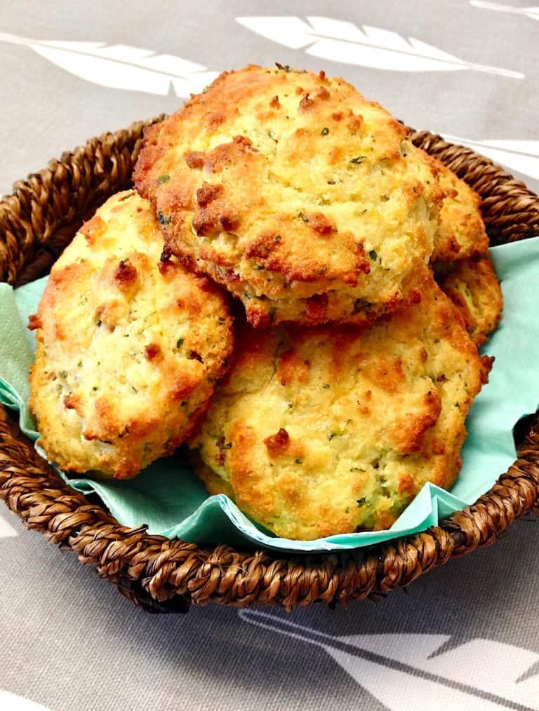basket with bacon cheddar drop biscuits stacked up