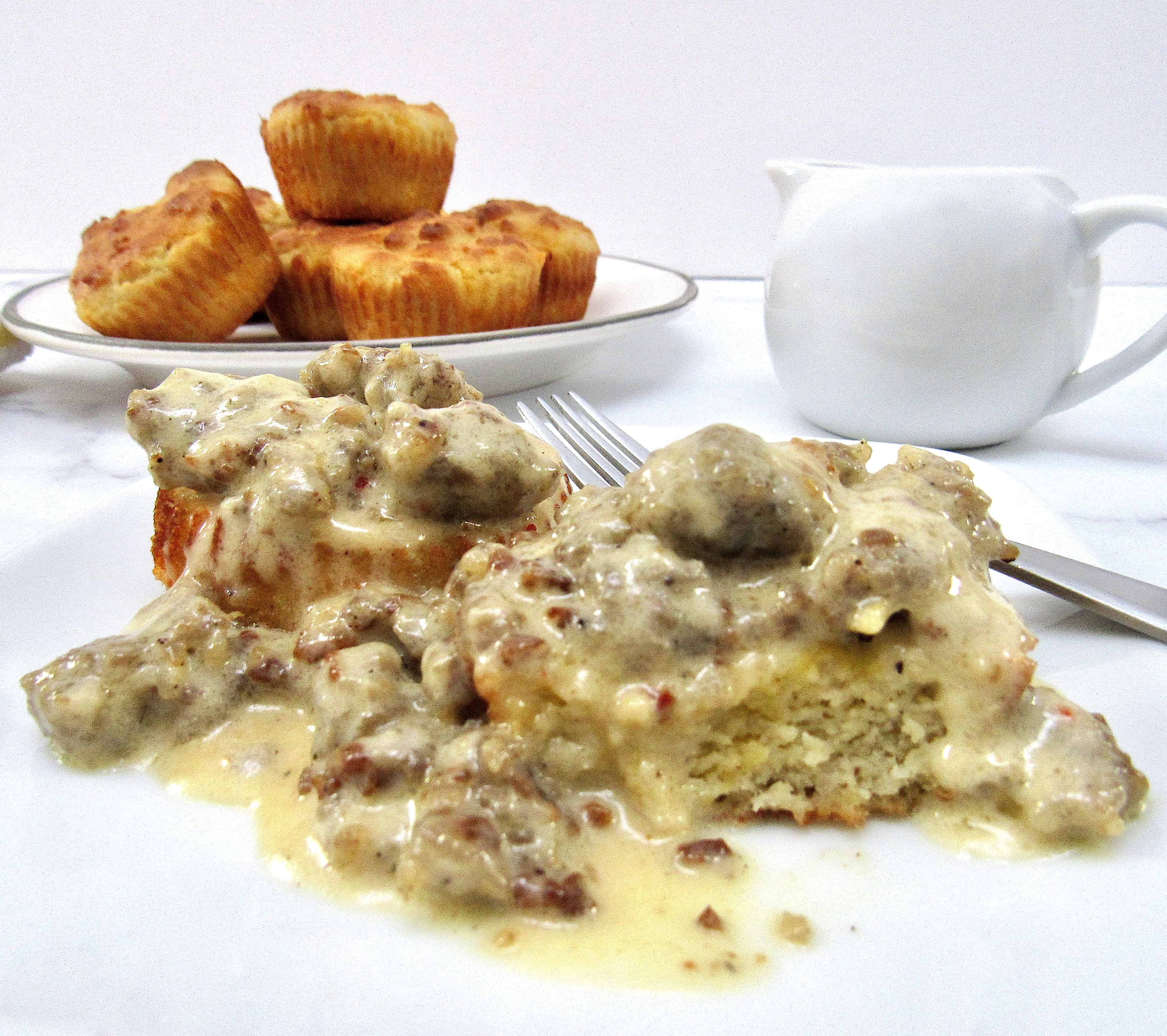 Biscuits and Gravy on plate with biscuits in background