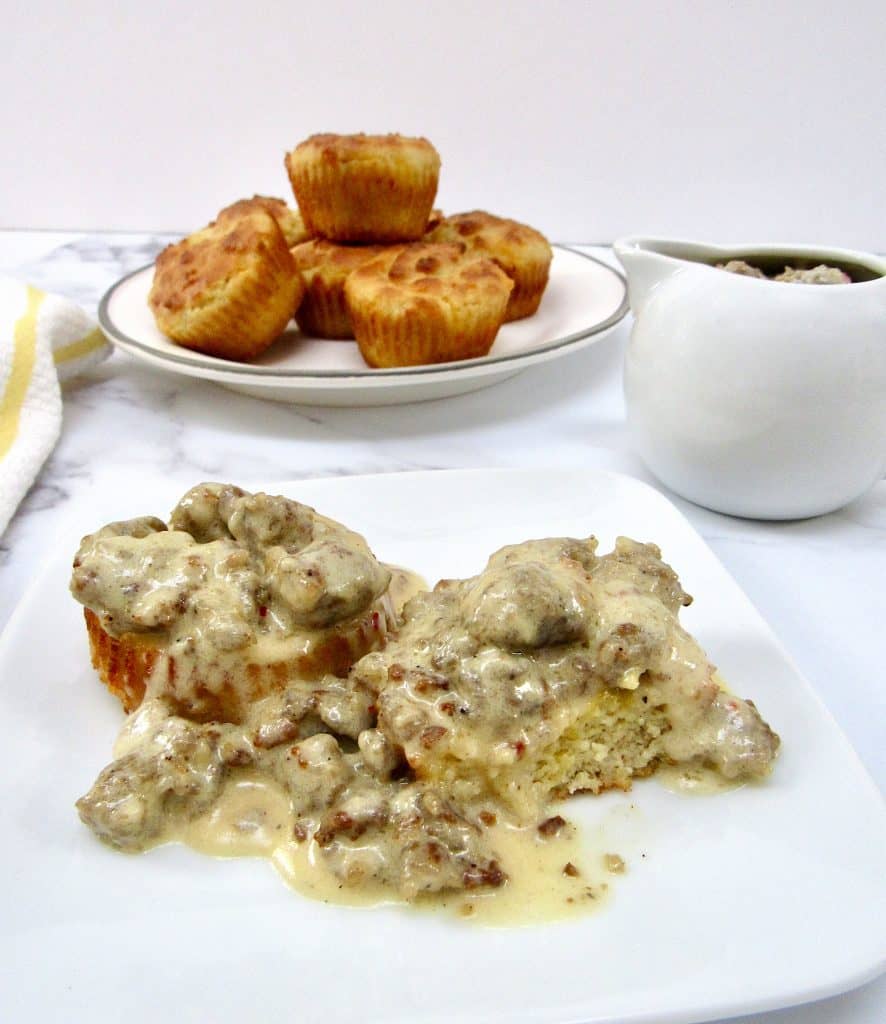 Biscuits and Gravy on plate with biscuits in background