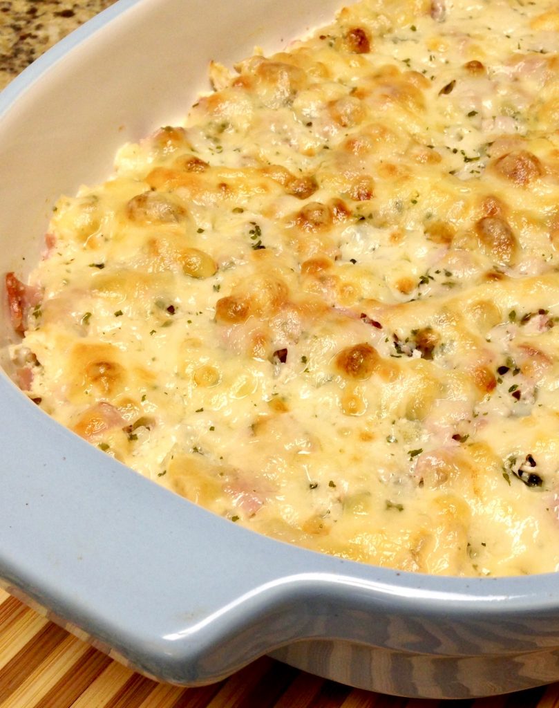 chicken, ham and cheese baked in a casserole dish