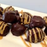 Keto Chocolate Peanut Butter Fat Bombs on white plate