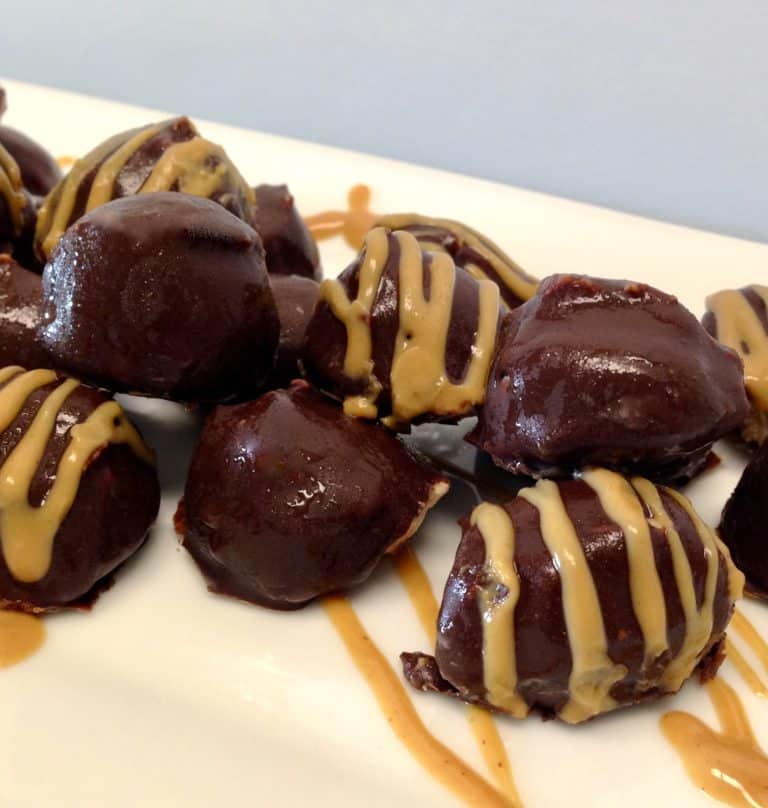 Keto Chocolate Peanut Butter Fat Bombs on white plate