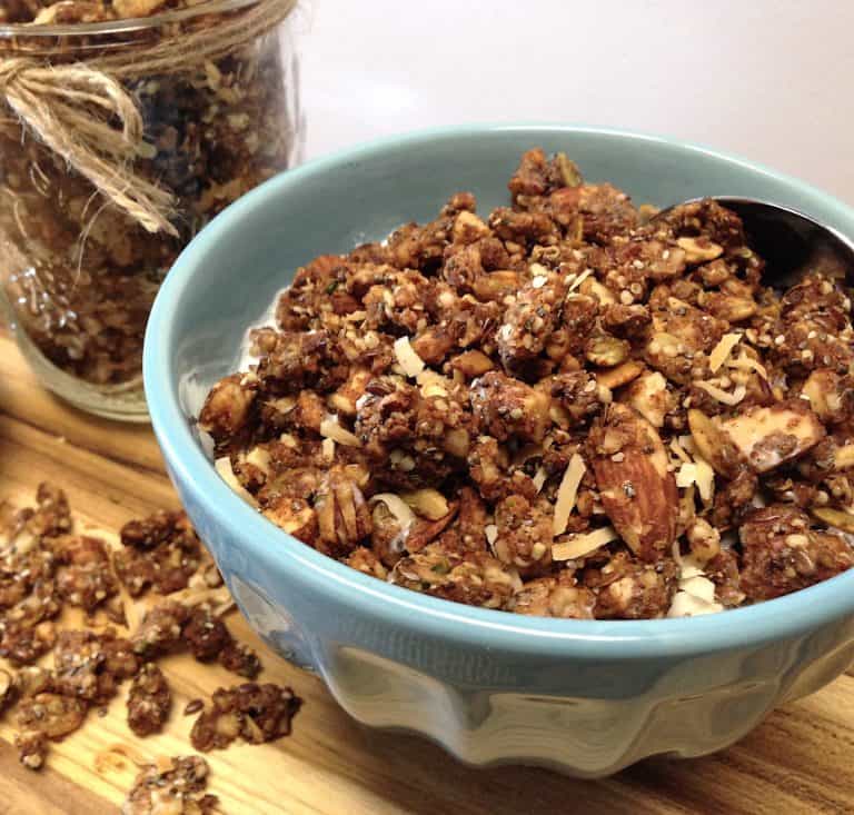 Keto Coconut Granola in blue bowl with milk