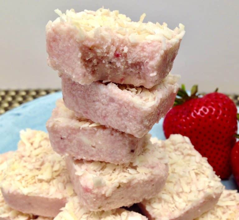 Strawberry Coconut Fat Bombs stacked up on blue plate