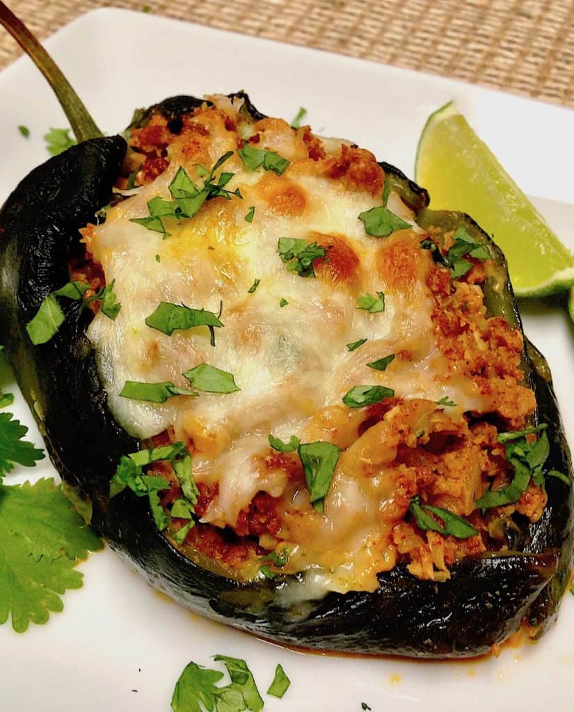 Stuffed Poblano pepper on white plate