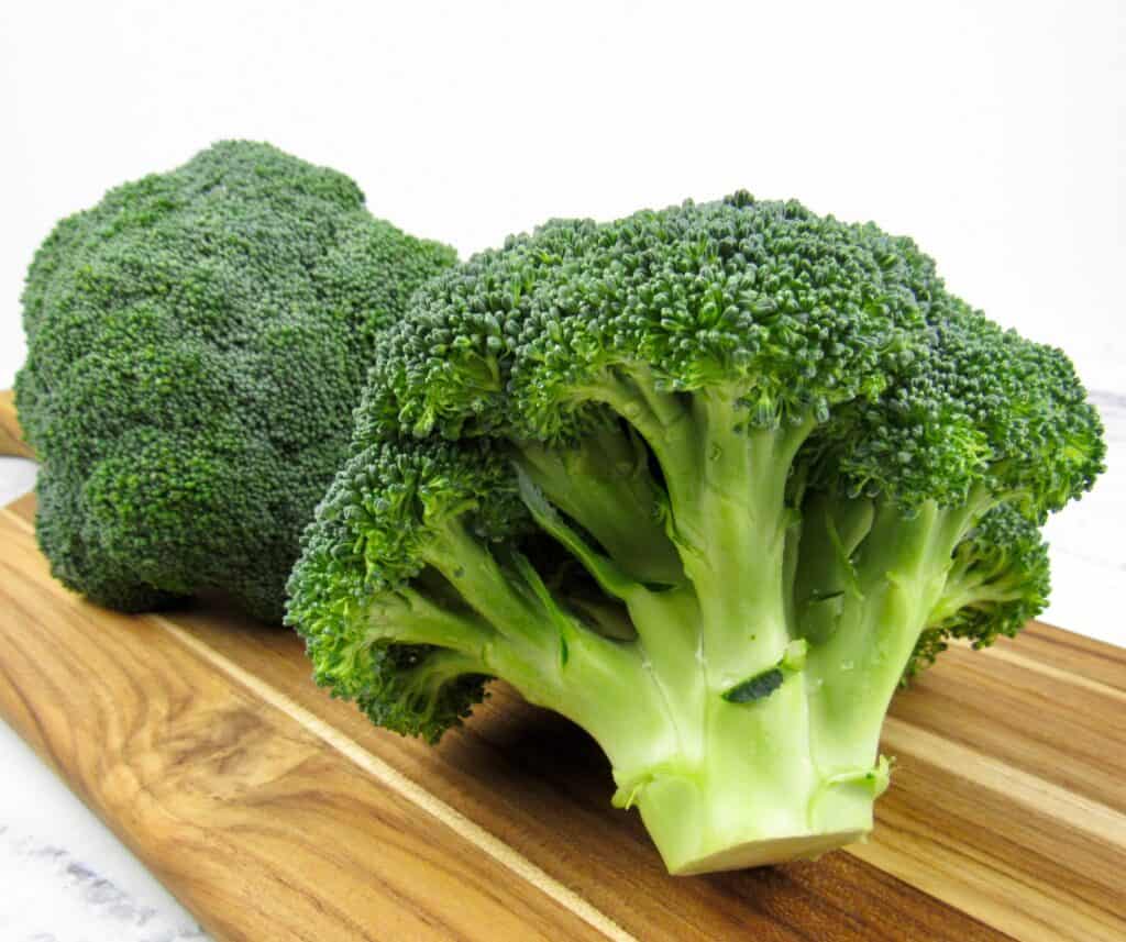 head of broccoli on cutting board