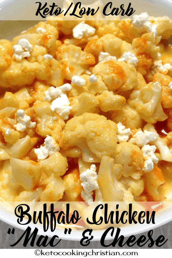 bowl of cauliflower with buffalo cheese sauce topped with blue cheese crumbles