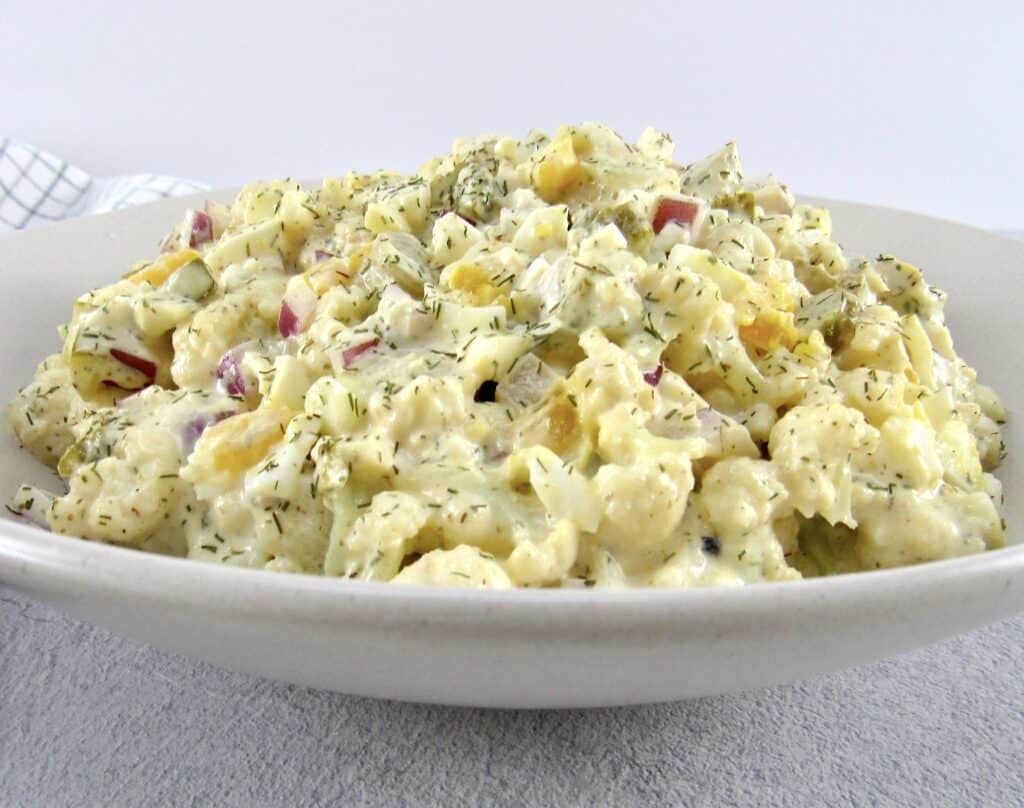 closeup of Cauliflower "Potato" Salad in beige bowl