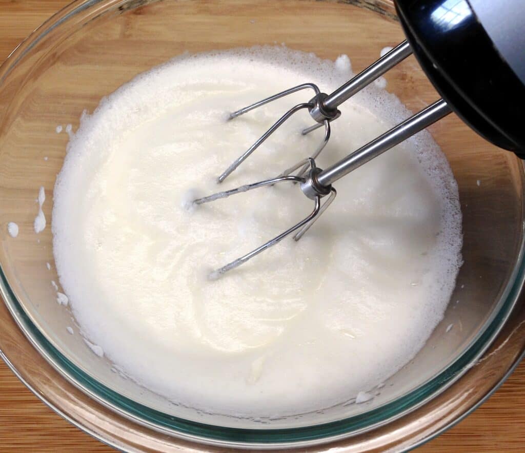 egg whites being whipped with mixer