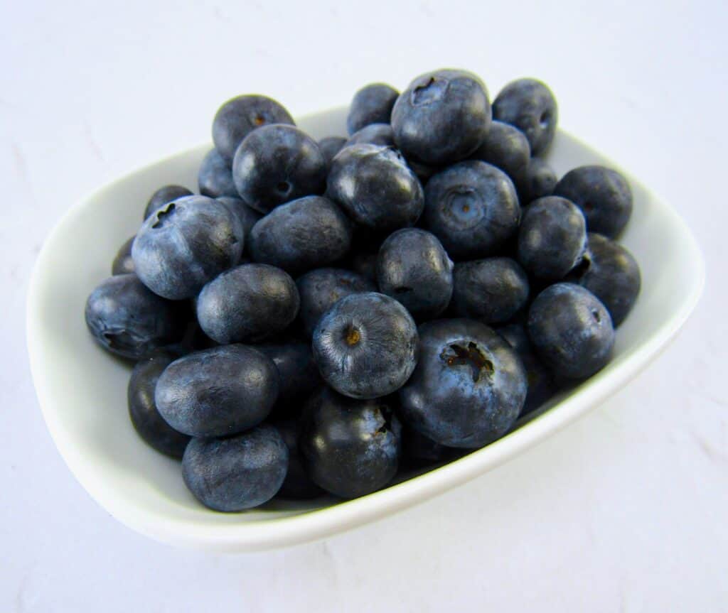 white bowl with fresh blueberries
