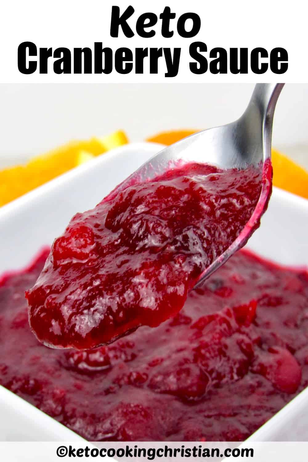 closeup of cranberry sauce in white dish with spoon holding some up