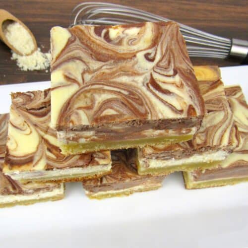 vanilla and chocolate swirl cheesecake slices stacked up