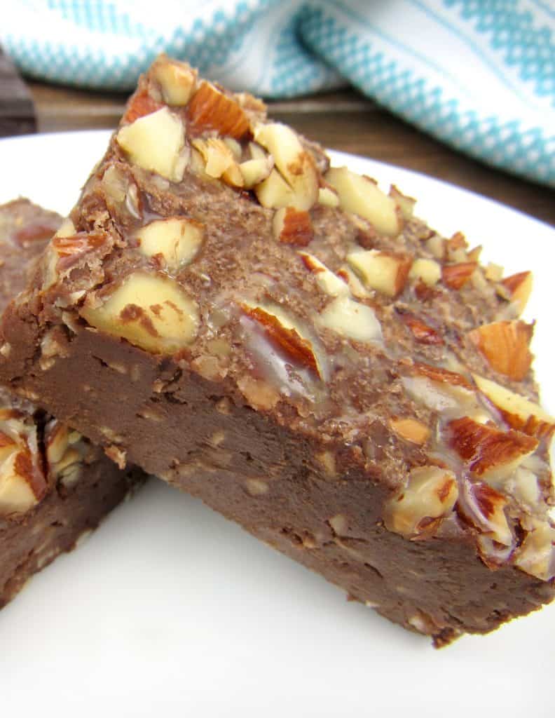 almond joy fudge stacked up on white plate