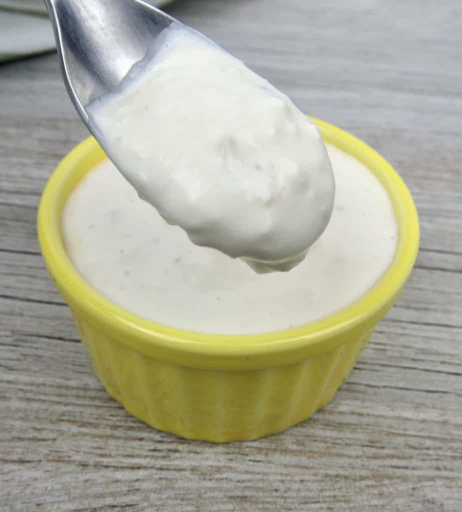 Keto Blue Cheese Dressing in yellow bowl with spoonful