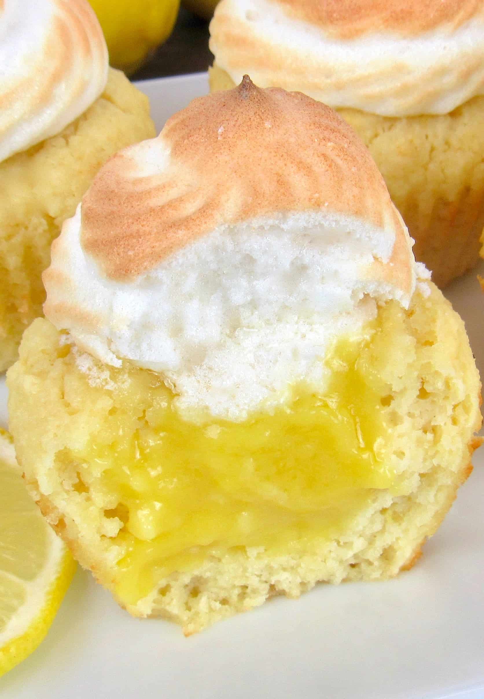 closeup of lemon meringue cupcake on white plate