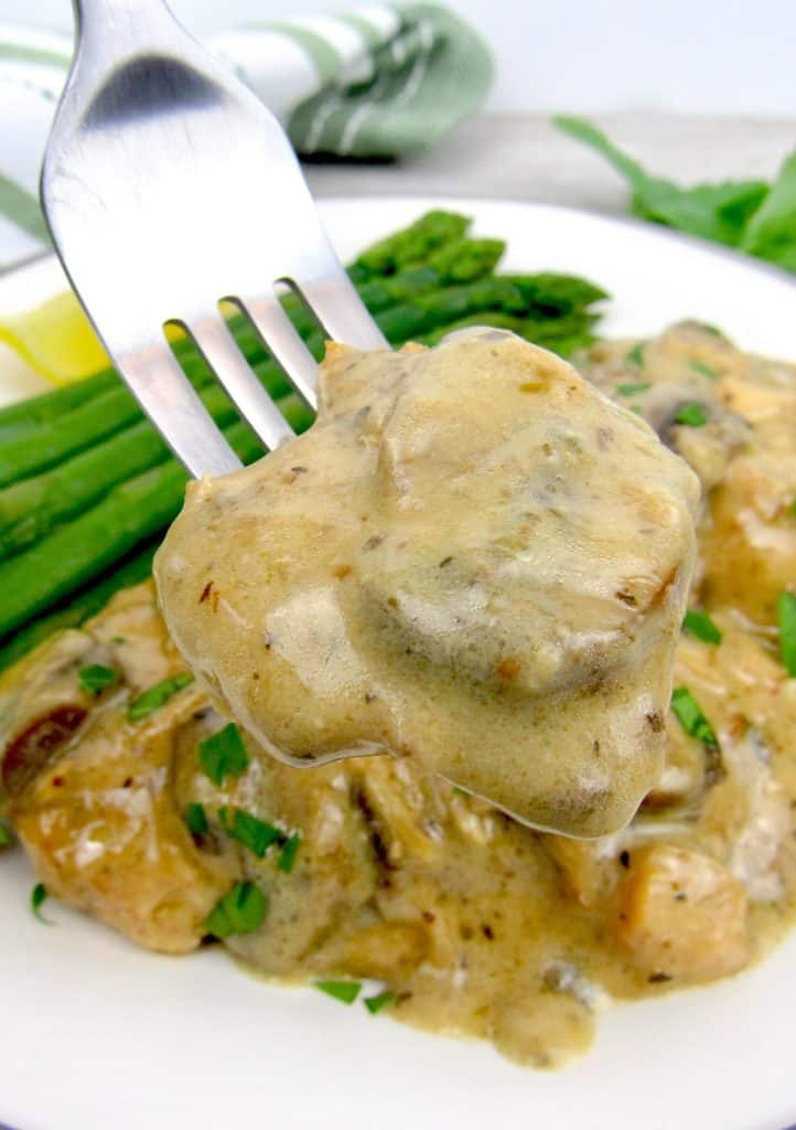 chicken marsala with fork holding up some