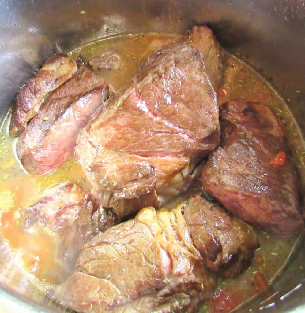 closeup of instant pot roast in stock