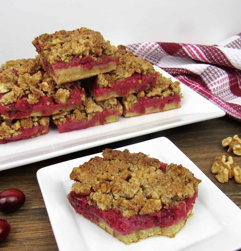 cranberry walnut crumble bars on white plate