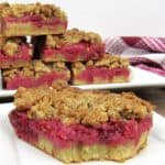 cranberry walnut crumble bars on white plate