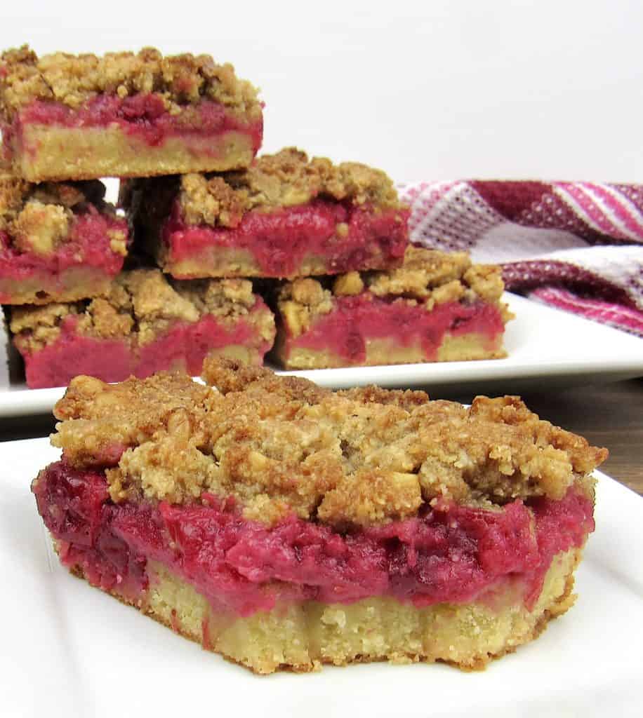 cranberry walnut crumble bars on white plate