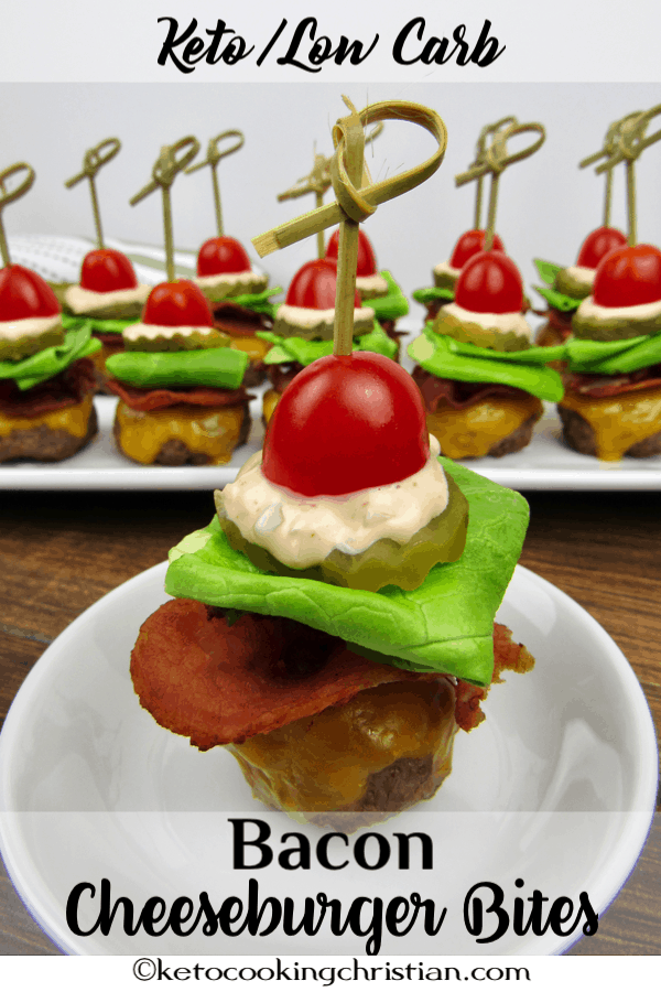 mini burgers with bacon cheese lettuce tomato and thousand island dressing with a skewer through the center