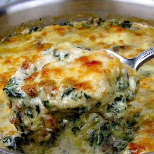 chicken florentine in skillet with spoonful