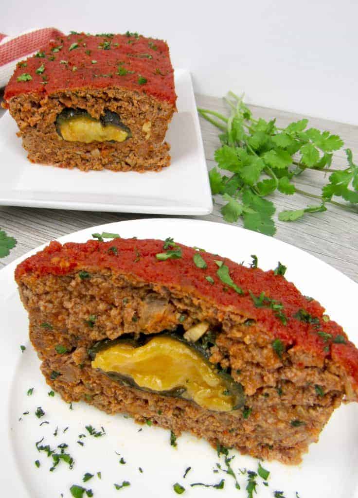meatloaf stuffed with poblano pepper and cheese with a slice on a plate