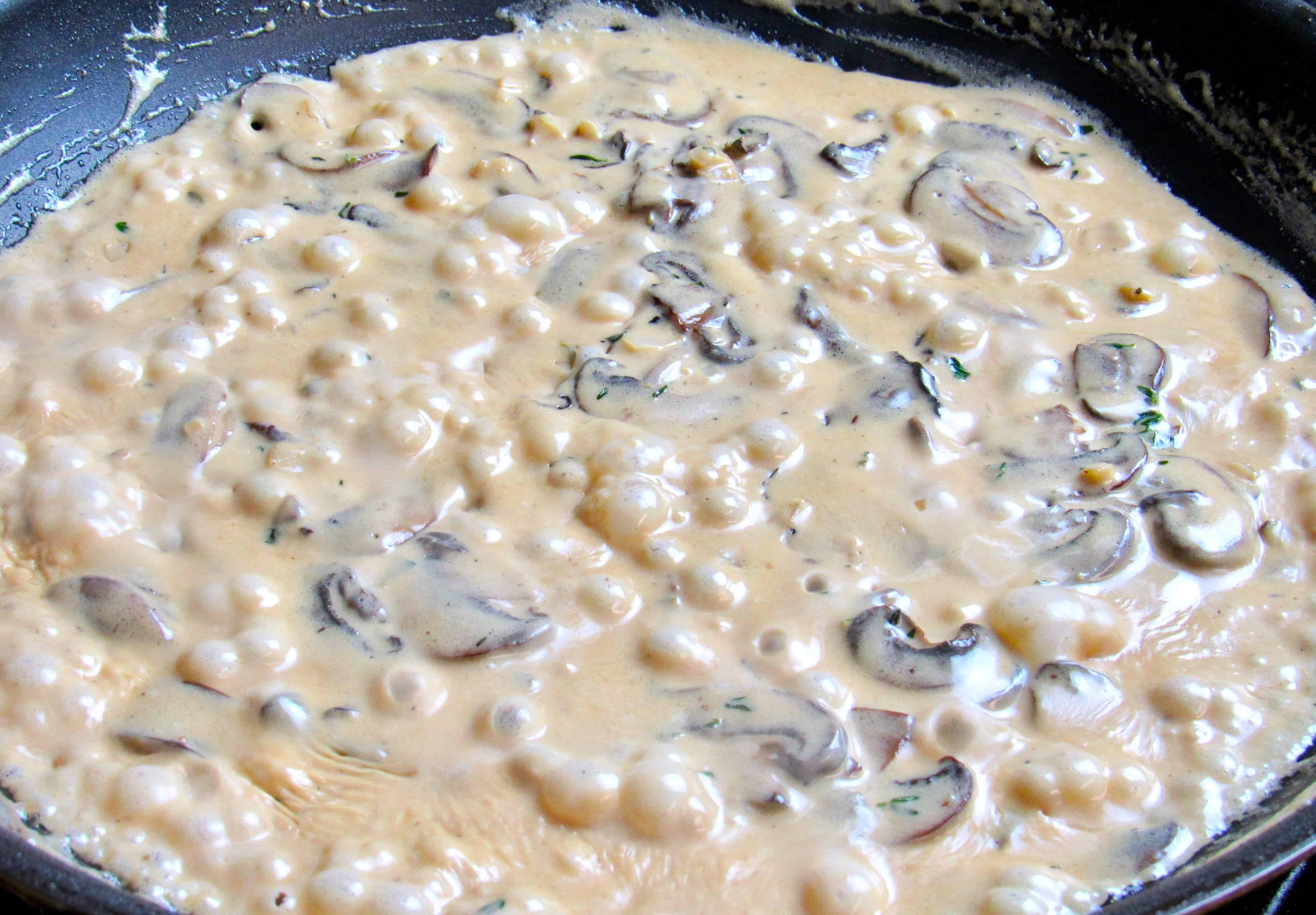 mushroom gravy cooking in skillet