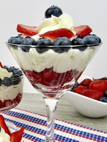 cheesecake mousse in glasses with berries on top