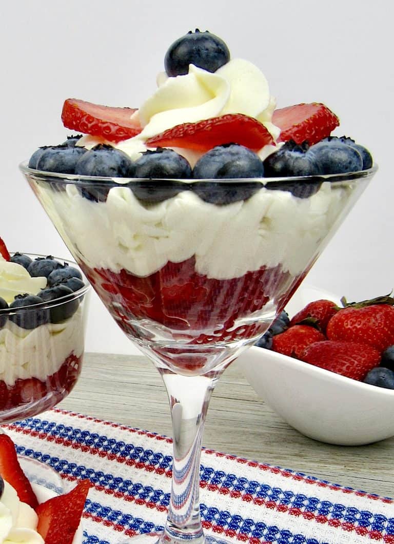 cheesecake mousse in glasses with berries on top