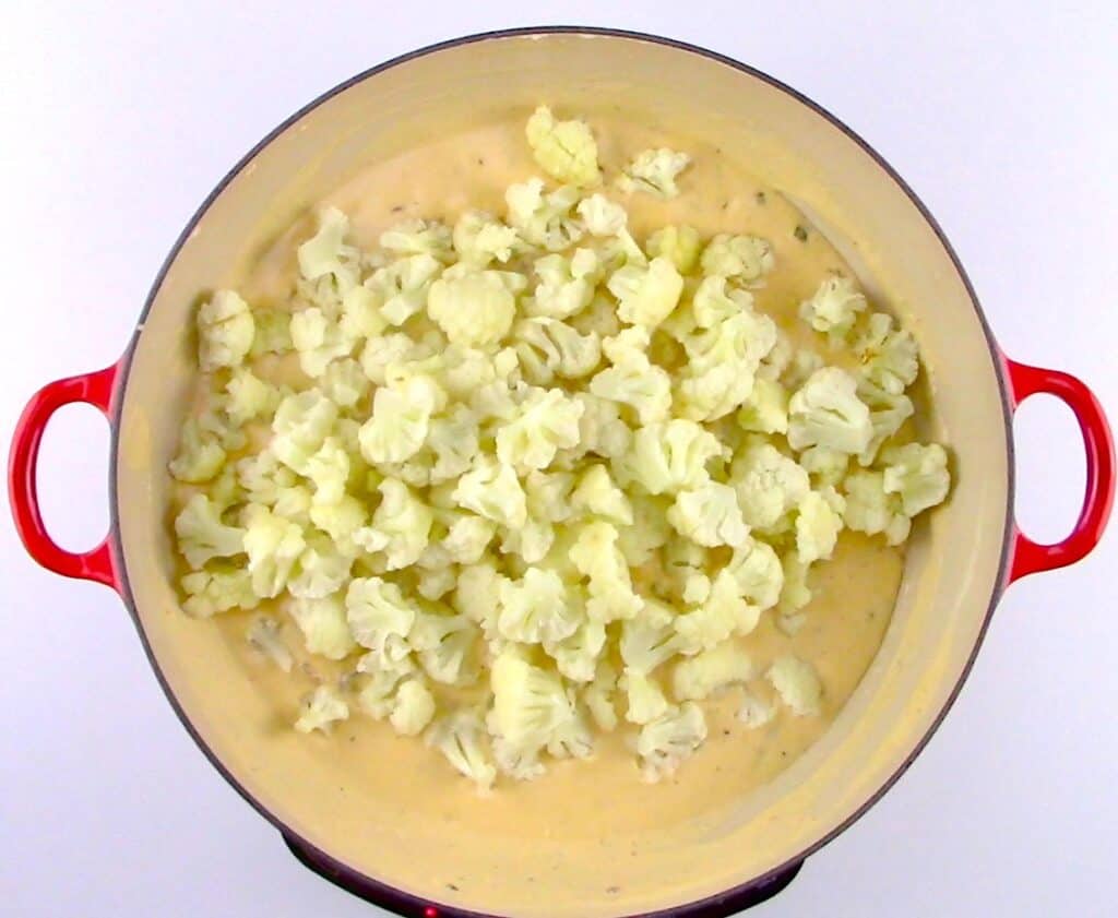 cheese sauce in skillet with cauliflower