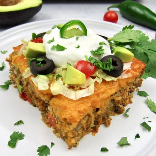 closeup slice of taco casserole with toppings