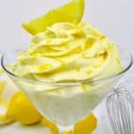 lemon cheesecake mousse with lemon zest and a lemon slice on top