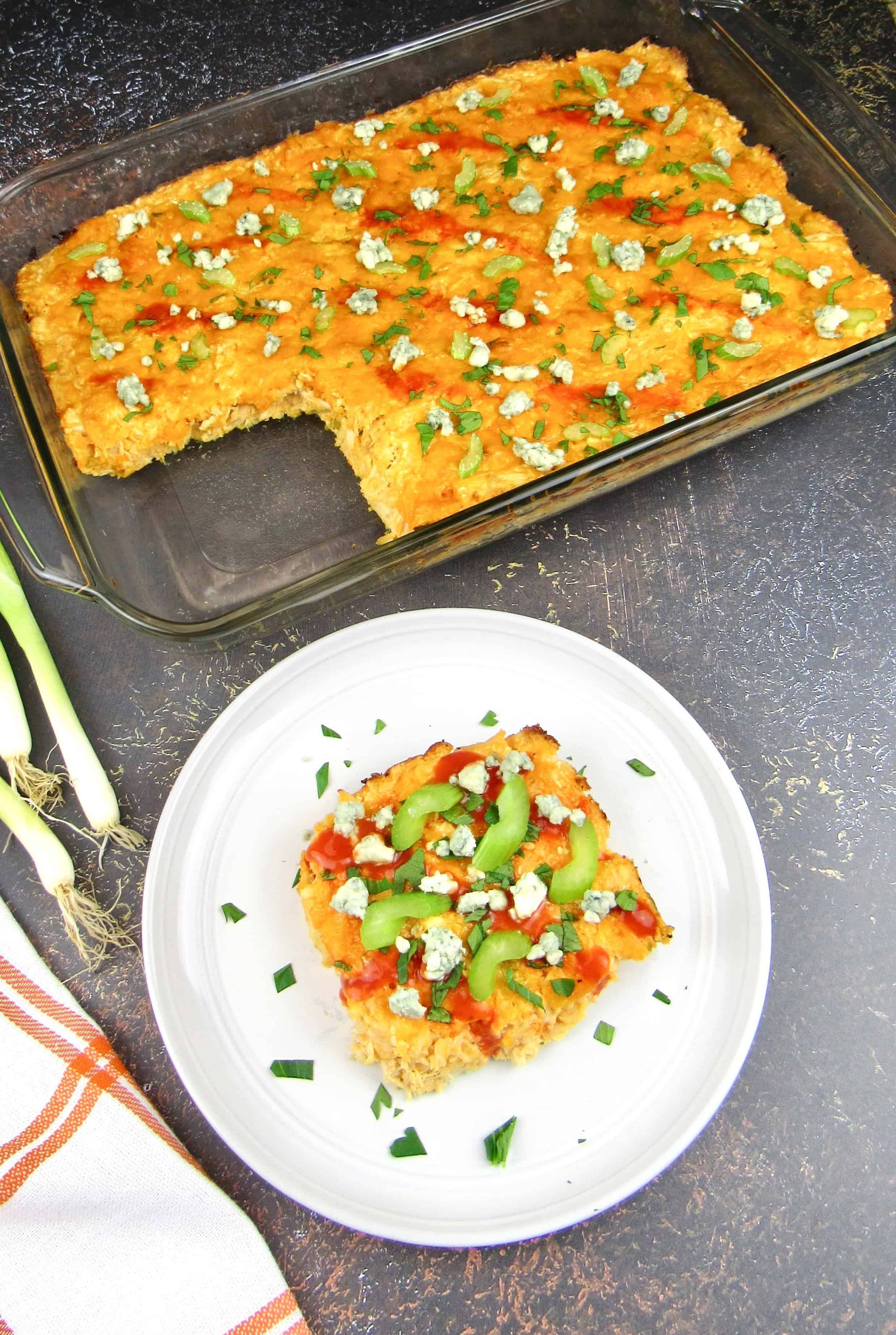 slice of buffalo chicken casserole and casserole with slice missing