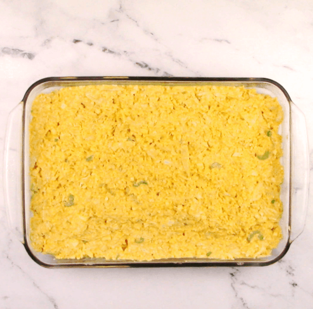 unbaked buffalo chicken casserole in glass baking dish